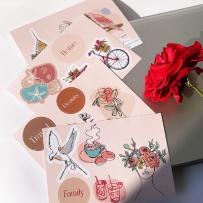 A collection of colorful stickers featuring various flowers and a prominent rose design.