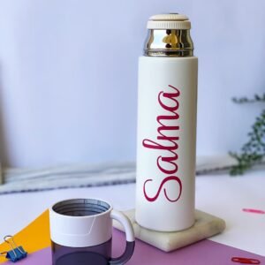 A white thermos with the name 