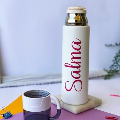 A white thermos with the name 