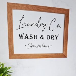 A sign with a wooden frame reads 