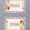Two ornate place settings on a textured table, each with colorful, patterned borders. Gold cutlery surrounds Arabic text in elegant pink script.