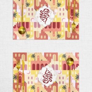 Two colorful placemats with abstract geometric patterns in red, yellow, and pink, featuring gold cutlery and Arabic calligraphy at the center.