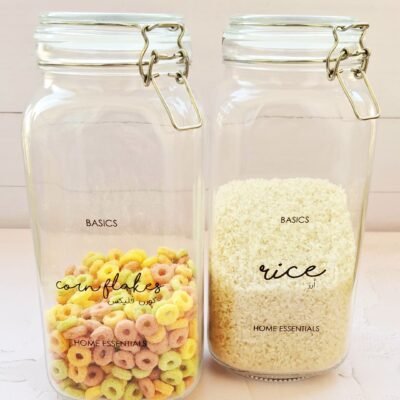 Two glass jars on a white background: one filled with colorful cereal labeled 