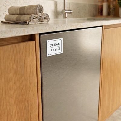Modern kitchen with wooden cabinets and a stainless steel dishwasher. A 