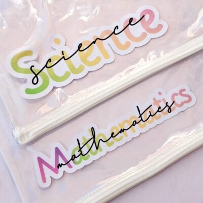 Pastel transparent files on a pink background feature colorful “Science” and “Mathematics” lettering, creating a playful, cheerful school theme.